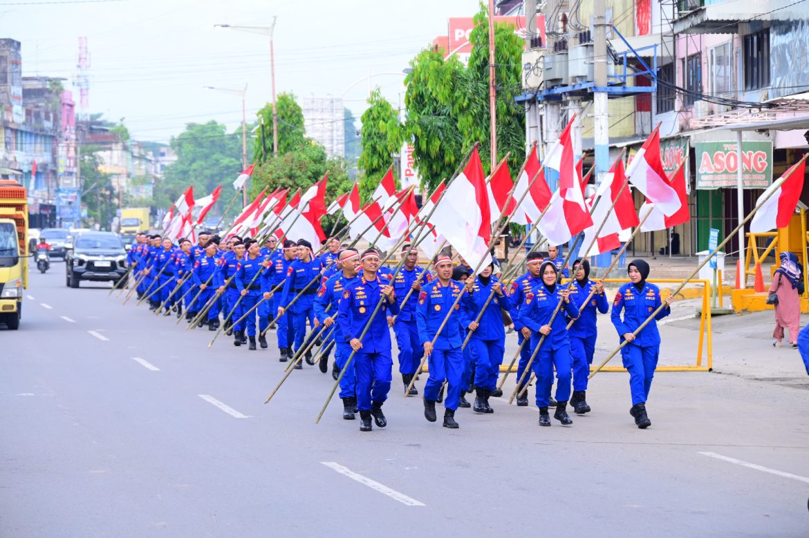 Ditpolairud Polda Jambi Gelorakan Semangat Kemerdekaan Lewat Pawai Bendera   